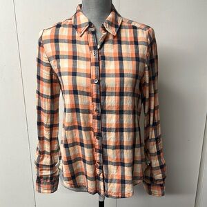 Adorable cotton orange and blue plaid shirt with long details in the back.
